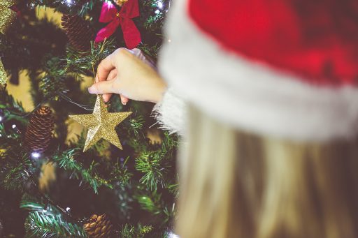young-woman-decorating-a-christmas-tree-picjumbo-com